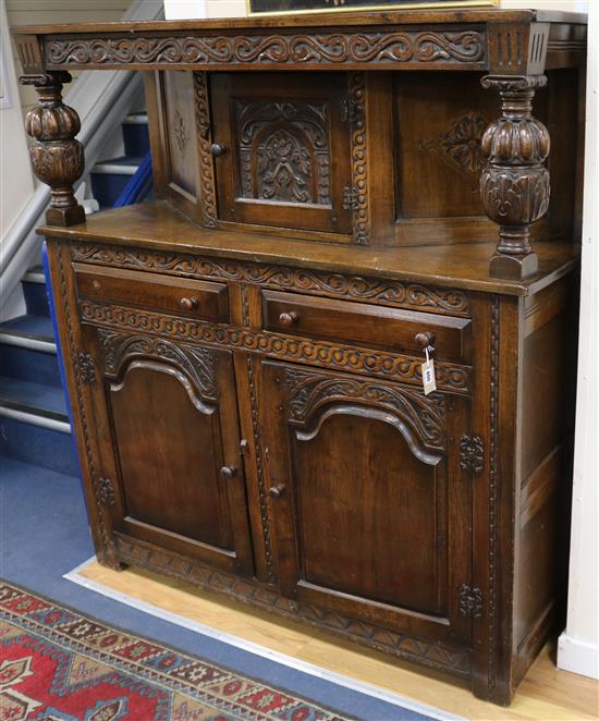 A 17th century style carved oak court cupboard W.141cm